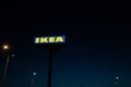 RIGA, LATVIA - APRIL 3, 2019: IKEA brand sign during dark evening and wind - Blue sky in the background