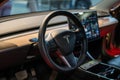 interor of Tesla Model Y. Tesla screen, steering wheel, interor car electric ev vehicle