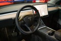 interor of Tesla Model Y. Tesla screen, steering wheel, interor car electric ev vehicle