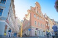 Riga, Latvia - August 10, 2014 - famous narrow medieval architecture building street with church towers in old town Riga, Latvia.