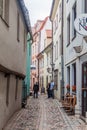 RIGA, LATVIA - AUGUST 19, 2016: Narrow cobbled alley Troksnu iela in the center of Riga, Latv