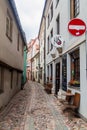 RIGA, LATVIA - AUGUST 19, 2016: Narrow cobbled alley Troksnu iela in the center of Riga, Latv