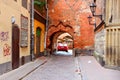 Scenery arch passageway in old city to Yana seta, Riga, Latvia Royalty Free Stock Photo