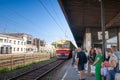 RIGA, LATVIA - AUGUST 20, 2023: Selective blur on a crowd of passengers waiting a suburban regional train of LDZ Latvijas