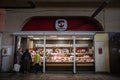 RIGA, LATVIA - AUGUST 23, 2023: Selective blur on a a group of clients buying meat at a butcher stall and shop of Centraltirgus, Royalty Free Stock Photo