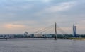 VanÃÂ¡u cable-stayed Bridge with Swedbank building, Latvian National Library and flag Royalty Free Stock Photo