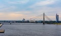 VanÃÂ¡u cable-stayed Bridge with Swedbank building, Latvian National Library and flag Royalty Free Stock Photo