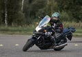 03-09-2019 Riga, Latvia A beautiful biker girl sitting on her superbike
