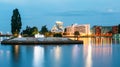 Riga Latvia Cityscape In Evening Illumination. View Of Embankmen