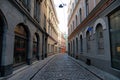 Riga / Latvia - 01 December 2019: Narrow medieval street in old city of Riga, Latvia Royalty Free Stock Photo