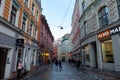 Riga / Latvia - 03 December 2019:Riga old town street with medieval buildings in winter day. Narrow street in Riga, Latvia Royalty Free Stock Photo