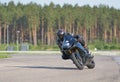 12-06-2020 Riga, Latvia. Fast motorbike racing on the race track at high speed. Composite image with heavy image editing