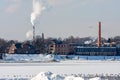 Industrial brick buildings and chimneys in winter