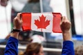 Flag of Canada in hands