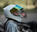 Riga, Latvia - 19.06.2019 Happy biker woman with a road helmet and thumb up isolated on a white background Royalty Free Stock Photo