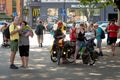 RIGA, LATVIA - JULY 18, 2018: The bike tourists stop at the city center on the street and watch the map.