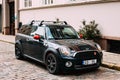 Black Color Car With Stripes Mini Cooper Clubman Parked On Street In Old Part European Town Royalty Free Stock Photo