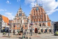 Riga, Latvia- July 7, 2023: House of the Blackheads, sculpture of Saint Roland and Saint Peters Church in old