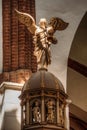 Riga, Latvia. Interior Of The Riga Dom Dome Cathedral Church. Decorative Elements, Wooden Statue Of Angel