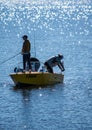 Riga, Latvia - July 10, 2023: people fishing from boats and the pier Daugavgriva breakwater or pier in the Gulf of Riga of the