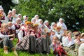 RIGA, LATVIA - JULY 06: People in national costumes at the Latvian National Song and Dance Festival on July 06, 2013. Holiday was