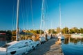 Many Yachts Moored At The City Pier Harbour And Quay In Summer Sunny Evening. Reflections From Boats In Water Of Western Royalty Free Stock Photo