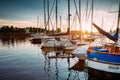 Many Yachts Moored At The City Pier Harbour And Quay In Summer Sunny Evening. Reflections From Boats In Water Of Western Royalty Free Stock Photo