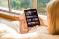 Riga, Latvia - July 21, 2018: Woman looking at Amazon Prime Video website on iPad.