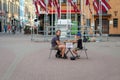 RIGA, LATVIA - JULY 26, 2018: A young boy on the street playing chess for money