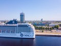 Aerial view of the MSC Orchestra cruise ship docked in Riga by the old town.