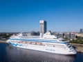 Aerial view of the MSC Orchestra cruise ship docked in Riga by the old town.