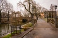 Riga, Latvia: Love padlocks as a symbol of eternal love and marriage fixed to metal railings on bridge in the Bastejkalna Park in Royalty Free Stock Photo