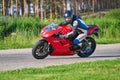 12-05-2020 Riga, Latvia. man on a motorbike on the road riding. having fun driving the empty road on a motorcycle tour journey Royalty Free Stock Photo