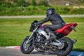 12-05-2020 Riga, Latvia. man on a motorbike on the road riding. having fun driving the empty road on a motorcycle tour journey