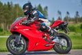 12-05-2020 Riga, Latvia. man on a motorbike on the road riding. having fun driving the empty road on a motorcycle tour journey Royalty Free Stock Photo