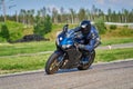 12-05-2020 Riga, Latvia. man on a motorbike on the road riding. having fun driving the empty road on a motorcycle tour journey Royalty Free Stock Photo