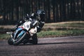 05-09-2020 Riga, Latvia Man on a motorbike on the road riding. having fun driving the empty road on a motorcycle tour