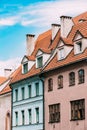 Riga Latvia. Mansard Tile Roof With Four Gable Fronted Dormer Windows On The Old Building Under Blue Sky Royalty Free Stock Photo