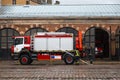 RIGA, LATVIA - MARCH 16, 2019: Fire truck is being cleaned - Driver washes firefighter truck at a depo