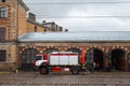 RIGA, LATVIA - MARCH 16, 2019: Fire truck is being cleaned - Driver washes firefighter truck at a depo
