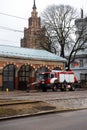 RIGA, LATVIA - MARCH 16, 2019: Fire truck is being cleaned - Driver washes firefighter truck at a depo - Scenic view