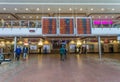 Riga, Latvia - May 7, 2017: Electronic timetable of trains, passengers and indoor veiw with passengers of the Central