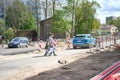 RIGA, LATVIA - MAY 13, 2022: Father with two kids crossing the road Royalty Free Stock Photo