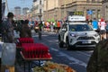 Riga, Latvia - May 19 2019: First Elite runners approaching refreshment station behind chase car