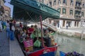 Riga, Latvia - May 16, 2017: Floating fruit and vegetable market in Venice, Italy. Sale on boat on canal. Tourists and Venetians Royalty Free Stock Photo