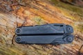 Riga, Latvia - May 80, 2022: Leatherman Surge Multitool in the forest