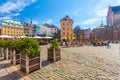 RIGA, LATVIA - MAY 06, 2017: View on the colored cozy old houses, churches and Dome Square with street cafes that are located i Royalty Free Stock Photo