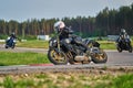 11-05-2020 Riga, Latvia. Motor biker on a race circuit speeding round a corner with a race circuit kerb behind