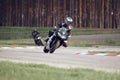 11-05-2020 Riga, Latvia. Motor biker on a race circuit speeding round a corner with a race circuit kerb behind