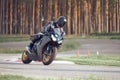 11-05-2020 Riga, Latvia. Motor biker on a race circuit speeding round a corner with a race circuit kerb behind